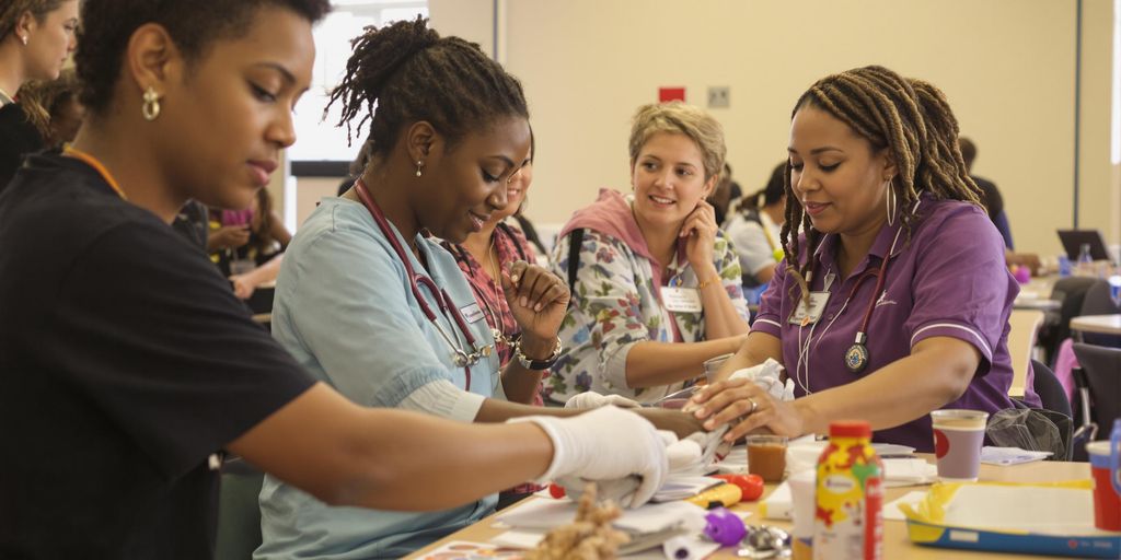 Group of caregivers in training, learning together in class.